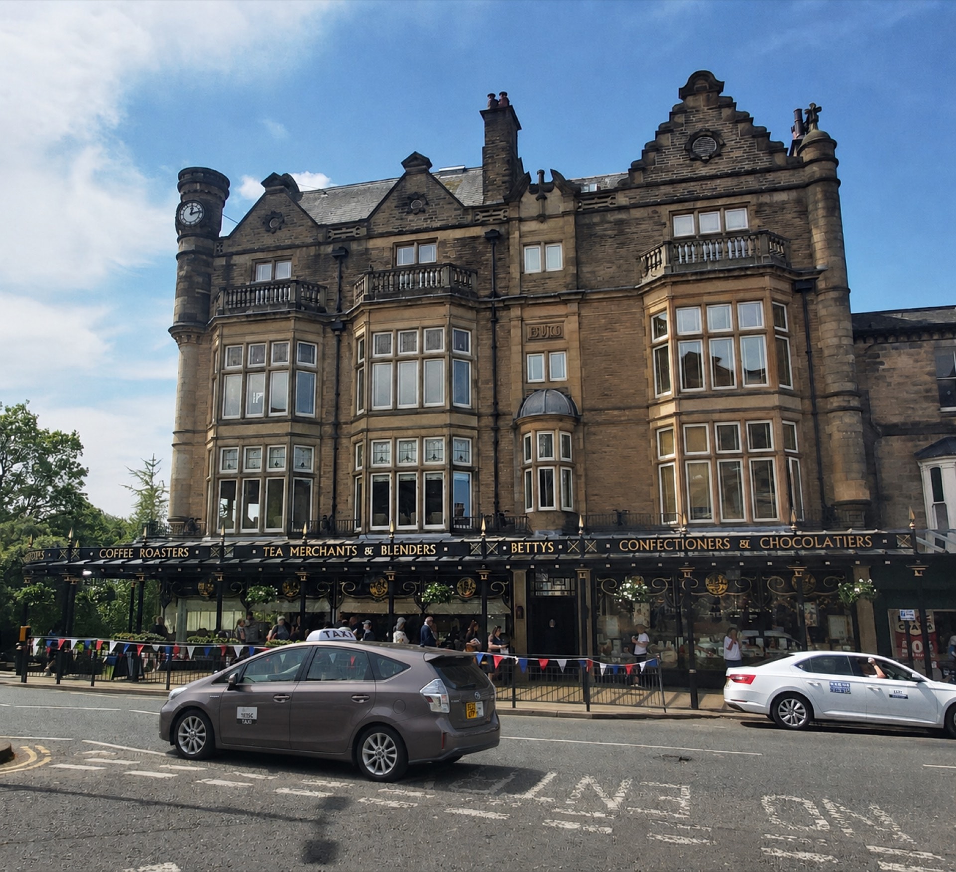 Harrogate taxi outside Betty's tearoom on Parliament Street